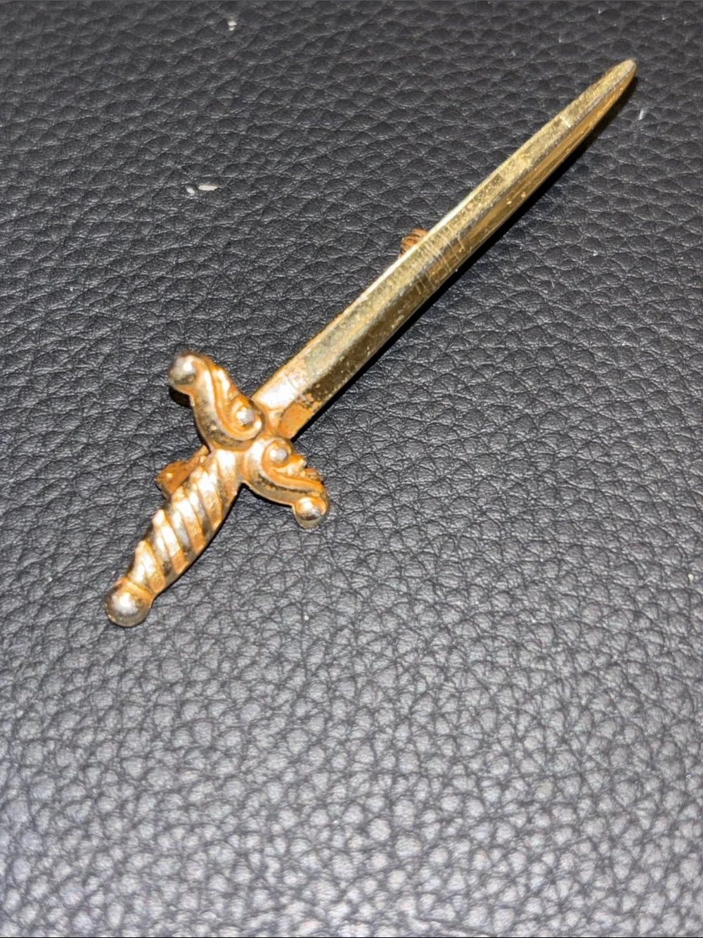 Vintage gold tone sword brooch